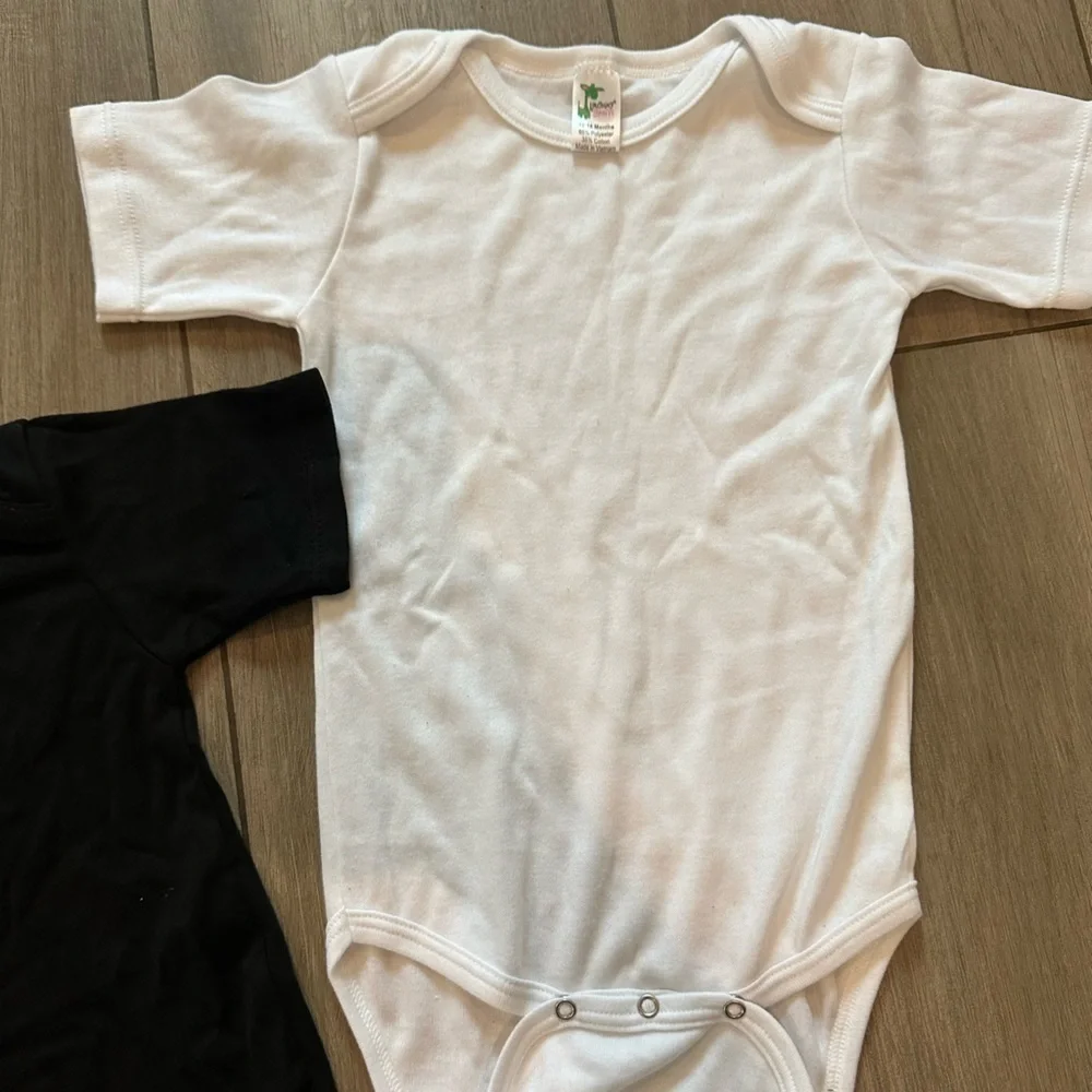 White and black onesie. Never been used.